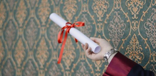 person holding diploma