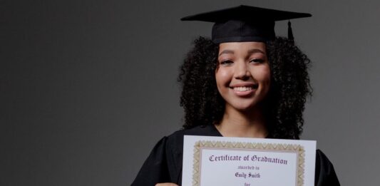 woman holding a diploma